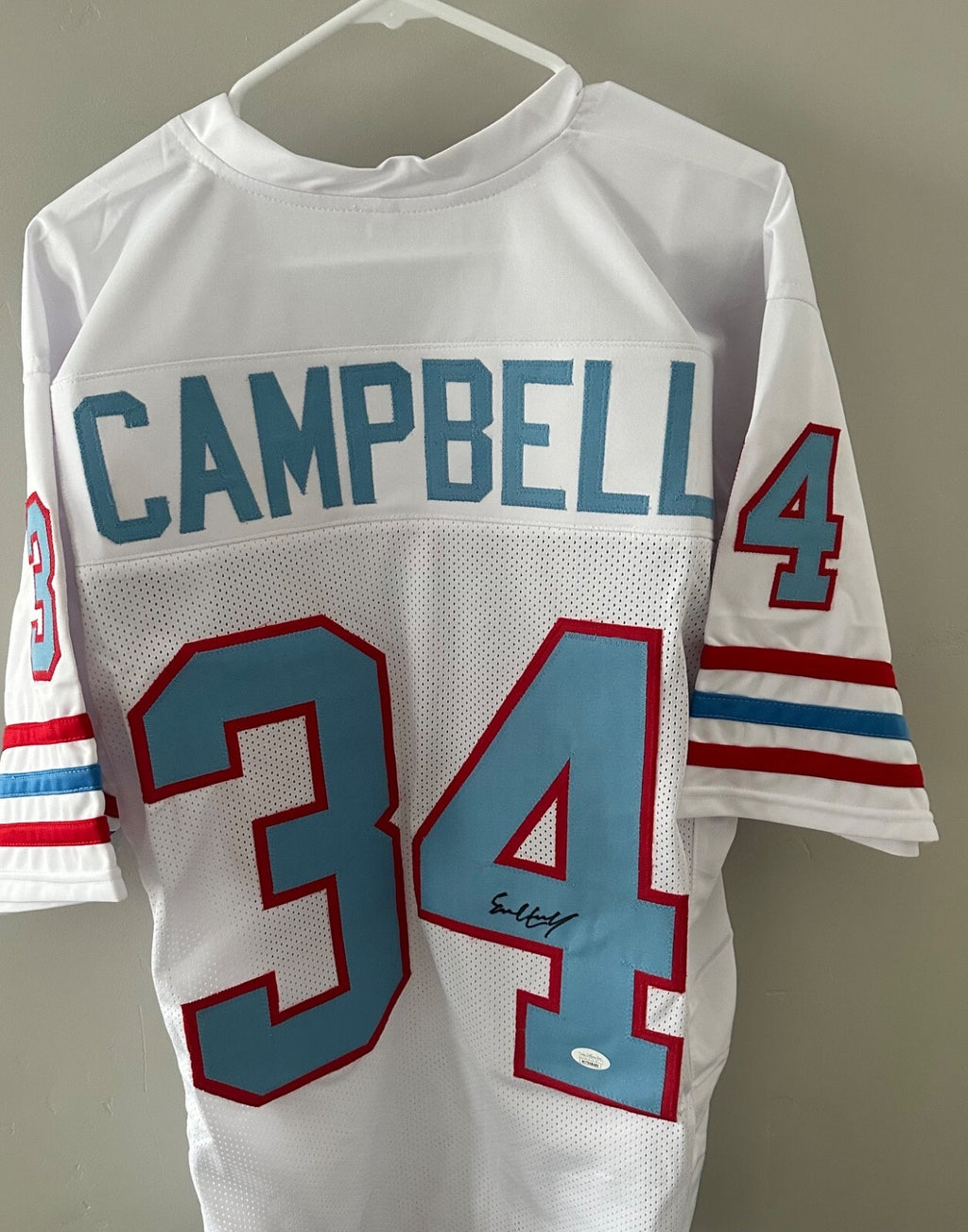 Autographed Earl Campbell Houston Oilers throwback jersey.