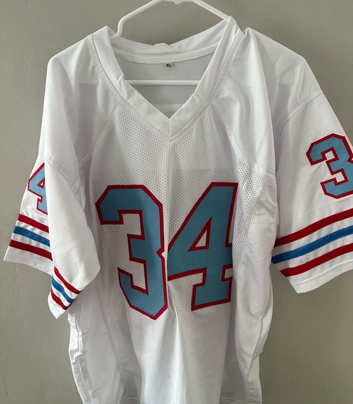Autographed Earl Campbell Houston Oilers throwback jersey.